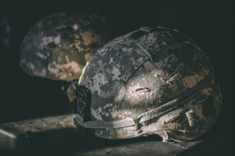 Army helmets on the ground.