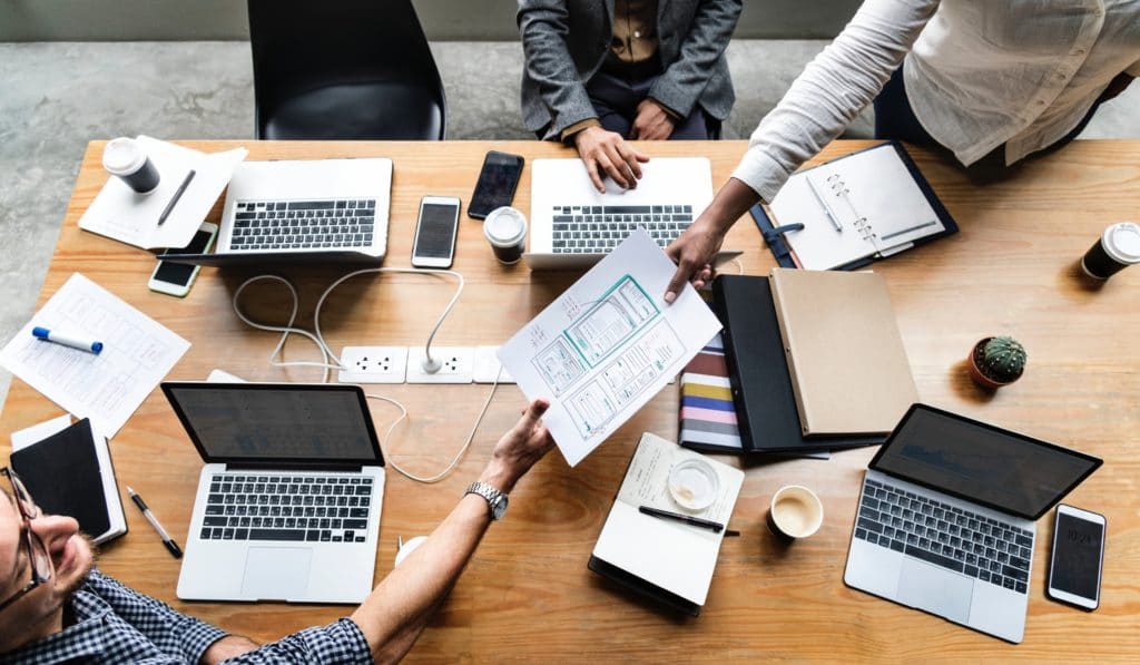 Business team sharing documents during a business meeting.