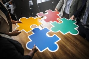 Business team holding puzzle pieces